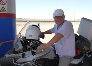 The petrol station owner was so pleased to have sat on Anne's bike, he gave her a big hug and a kiss