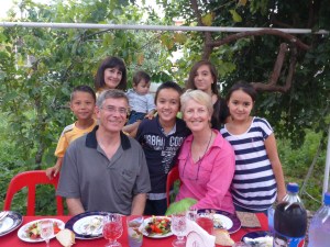 A memorable evening in Samarkand:  Gulnoza and baby Omar behind Anthony and Aziza's kids Muqhbar and Raziza on either side of Anne, and Aziza's niece Sabina behind Anne