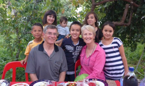A memorable evening in Samarkand: Gulnoza and baby Omar behind Anthony and Aziza's kids Muqhbar and Raziza on either side of Anne, and Aziza's niece Sabina behind Anne