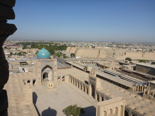 Emir Alim Khan madrassah, Poi-Kalon ensemble, Bukhara, Uzbekistan and view towards the citadel