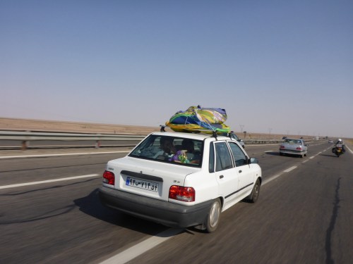 Friendly waves but I do wish the drivers didn't cut in front of us that way - on our way to Kashan, Iran