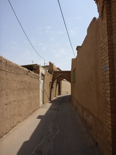 Not that white door!!  Our hotel entrance is just past the archway.  Kashan, Iran