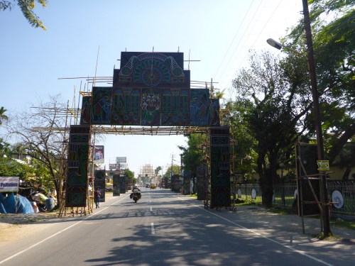 Riding past some of the decorations that will be lit up for Diwali, festival of lights, West Bengal