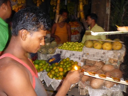 Lighting the mustard oil lamps for Diwali, Guwahati