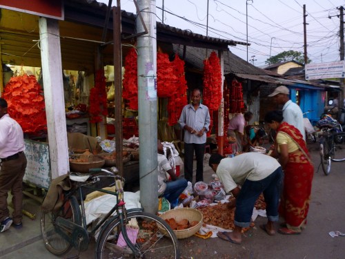 Seller of flowers, offerings, and oil lamps for Diwali in Guwahati