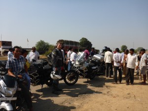 Yet another silent crowd gathers, bemused, around us