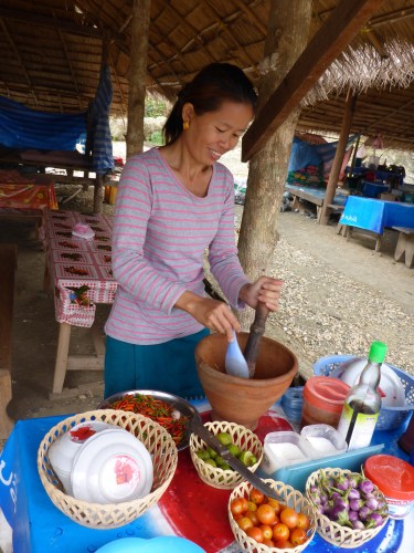 Preparing our green papaya salad for breakfast, Laos