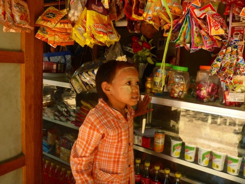 Myanmar girl carefully choosing her candy