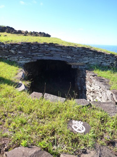 Partly reconstructed house at Orongo, showing the corbelled roof devised after all trees had been cut down and could no longer be used for rafters