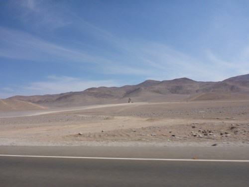 The hand in the background