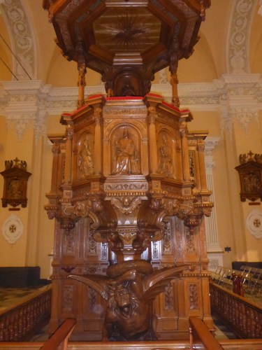 Oak pulpit made in Lille, France has a devil carved at the base