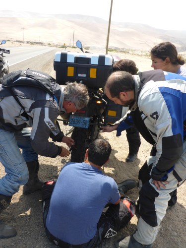 Helping fix a puncture for Ian and Stephanie amd their BMW F700 GS like ours.