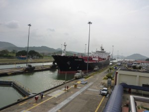 Condensate tanker being guided by trucks along the lock, Panama Canal