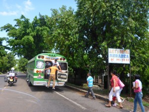 These buses barely stop to let passengers on and off in El Savador