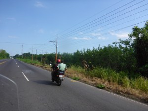 Security guy riding with his shotgun across his lap, Escuintla, Guatemala