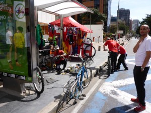 Good use of a bus stop for bicycle tyre repair on Sunday, Bogota, Colombia