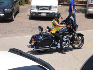 Love her pigtails attached to her helmet -  marshall for the 86 Harleys arriving at the tavern