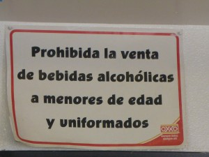 Sign in a roadside cafe in Mexico - no alcohol for minors or people in uniform