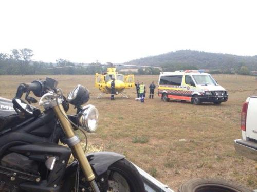 Slightly dented bike and rider about to be transported for repair.