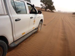 Local guide John driving us out of Anne's mess