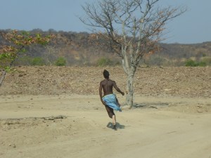 Himba teenager showing us the way across the creek